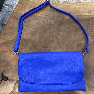 Brand new soft faux leather, blue purse.